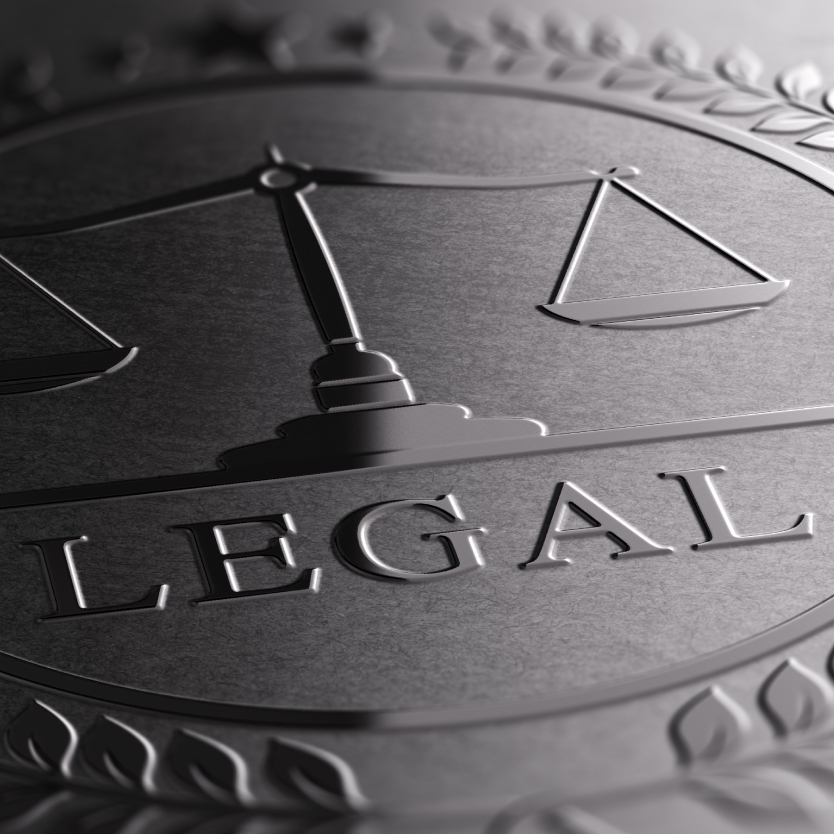 Silver Scales with the word Legal under it