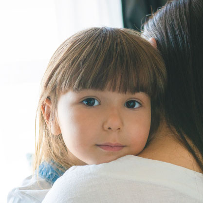 Girl Embracing Mom